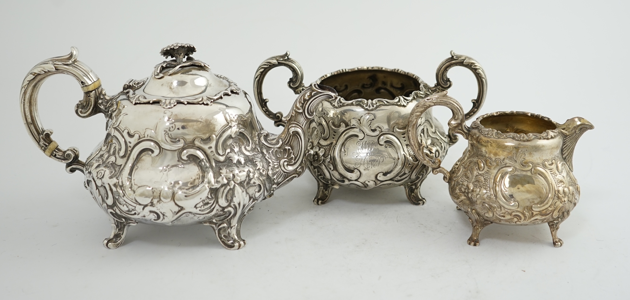 A matched Victorian and later silver three piece tea set